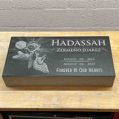 Serene Reflections - Black Granite Headstone Memorial Marker with Angelic Emblem and Blossom Accents